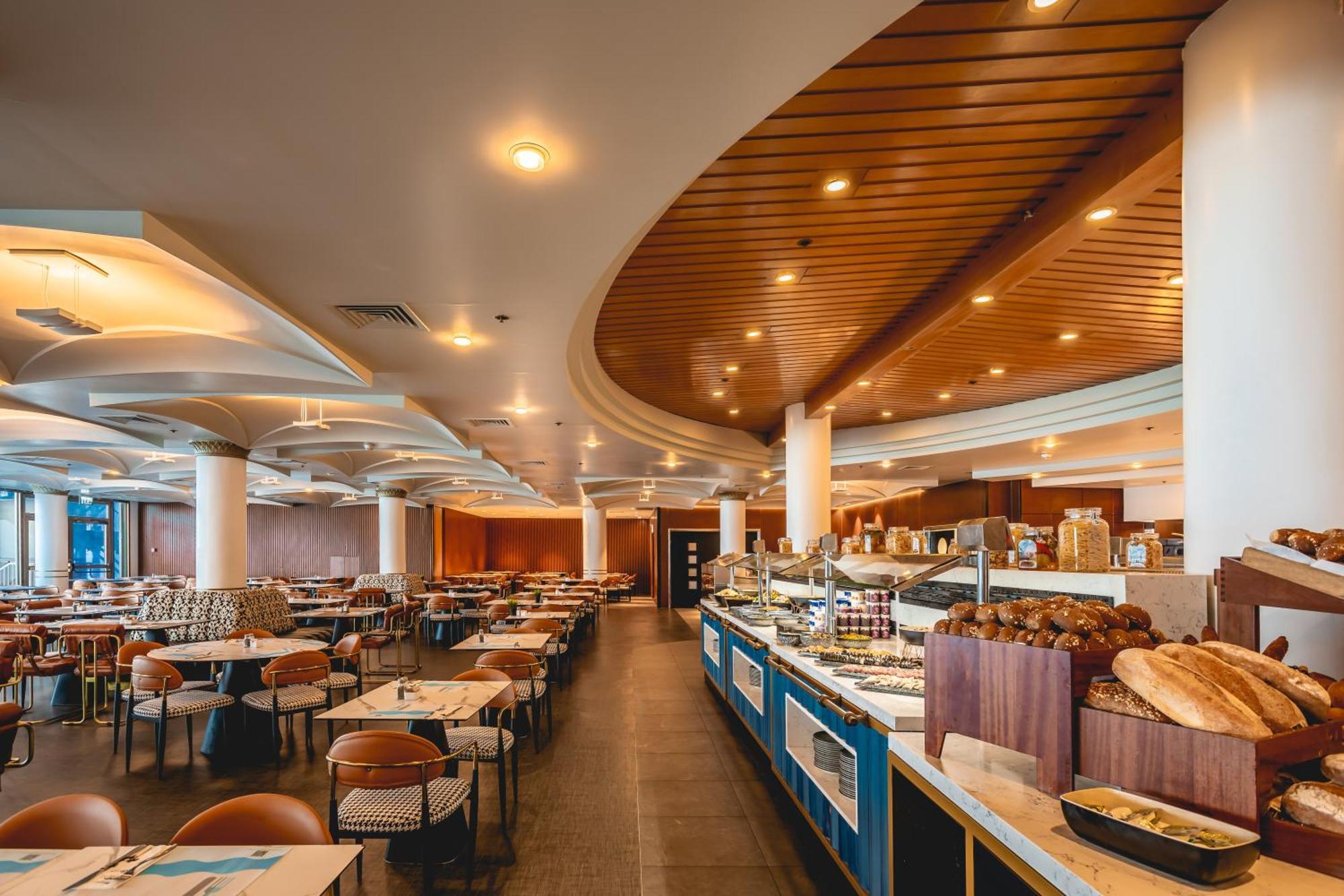 ダニエル ヘルツリーヤ ホテル Herzelia エクステリア 写真 The restaurant at the hotel